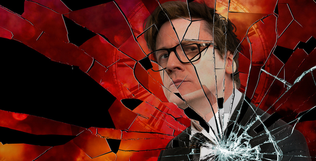 Shattered mirror effect with a red fire style background and a man with short brown hair and glasses looking into the distance