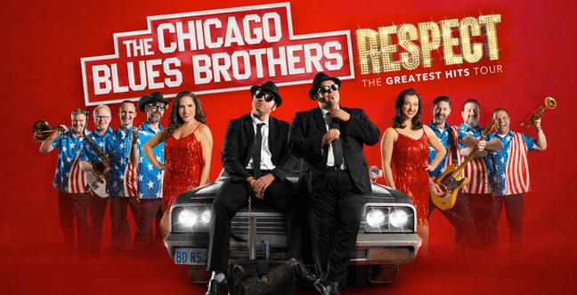 A group of people against a red backdrop stand beside a car while two men dressed as the blues brothers sit on the car bonnet, below the title 'The Chicago Blues Brothers Respect'