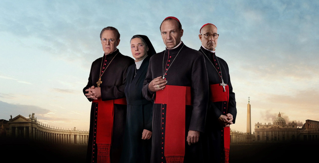 A group of people wearing Catholic dress stand in front of a sunset