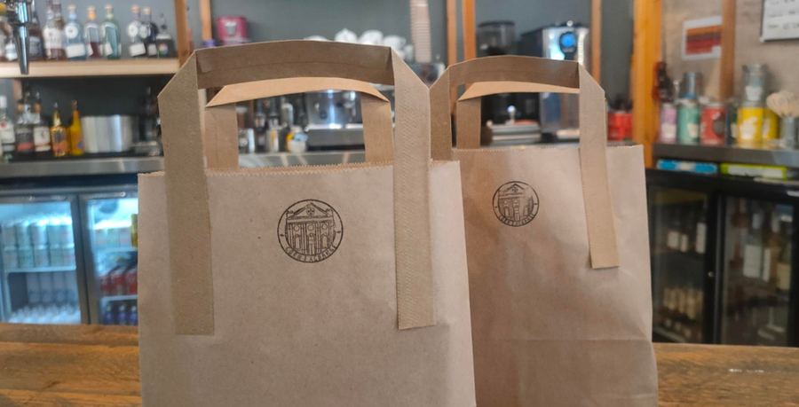 Two brown bags with a stamp of the Corn Exchange on them