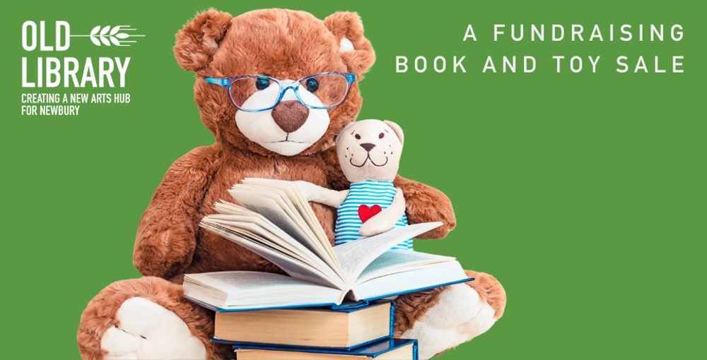 A teddy bear with glasses and books against a green backdrop
